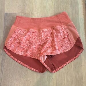 Outdoor Voices Hudson shorts, 2.5 inch, Orange Red Pattern Color Block